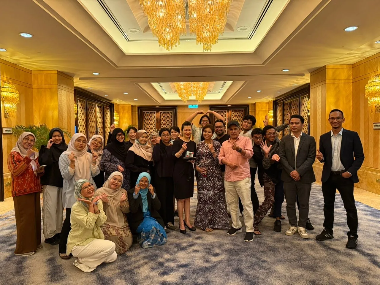 Duoz workshop group celebrating together at an event