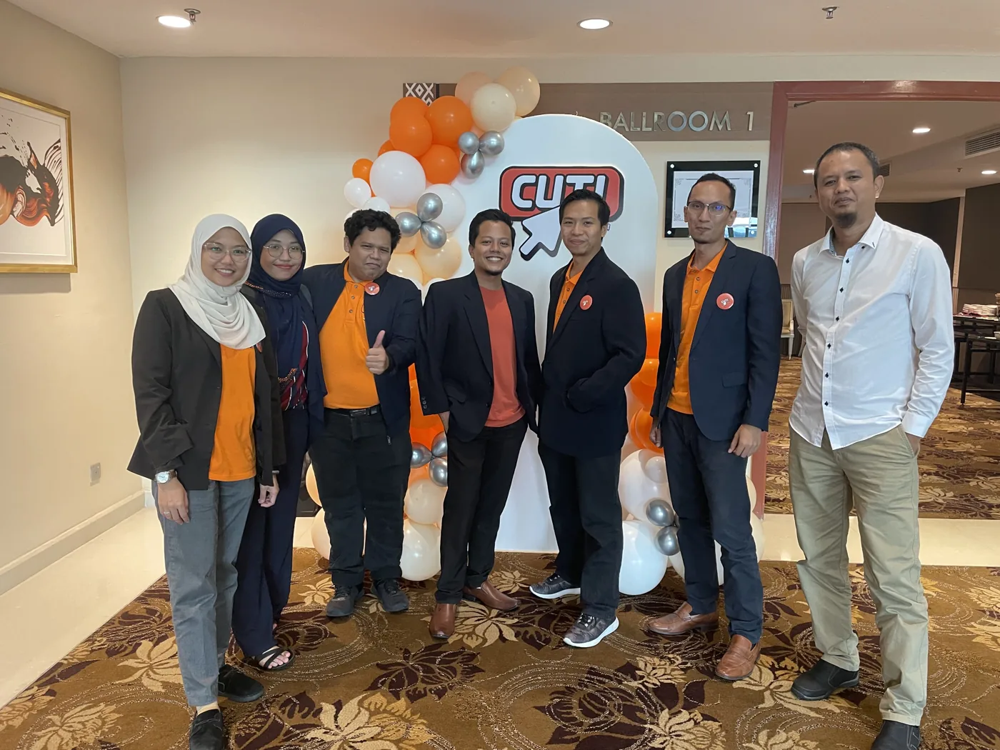 Huzaifah Za'ba with the Duoz team at an industry event